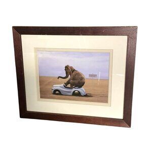 Framed Elephant On Toy Car Art Print In Wooden Frame With Beige Matting